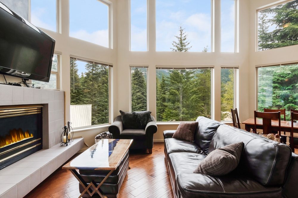Living room with fireplace and mountain views